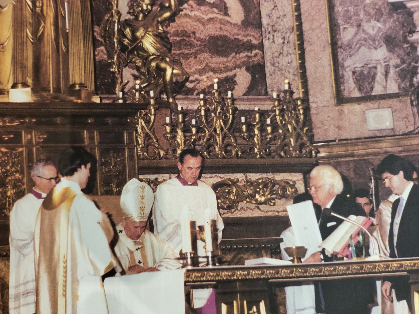 A solemn ecclesiastical moment in 1980s Rome with Pope John Paul II and Egidio Giansanti